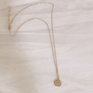Gold “K” charm necklace